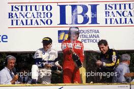 Nelson Piquet (BRA) Brabham 2nd position Alain Prost (FRA) McLaren 1st position Ayrton Senna da Silva (BRA) Lotus 3rd position celebrates podium