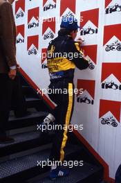 Ayrton Senna da Silva (BRA) Lotus signs an autograph on the podium stair