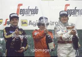 Race Podium:Elio de Angelis (ITA) 1st position,Alain Prost (FRA)disqualified and Thierry Boutsen (BEL) 2nd position