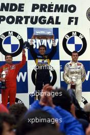 Ayrton Senna da Silva (BRA) Lotus 97T Renault 1st position,Michele Alboreto (ITA) Ferrari 2nd position,Patrick Tambay (FRA) Renault 3rd position celebrate podium