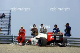 Niki Lauda (AUT) McLaren MP4/2B Tag Porsche stop during practices