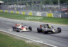 Alain Prost (FRA) McLaren MP4/2B battles with Airton Senna Da Silva (BRA) Lotus 97T Renault at Tosa bend
