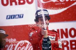 Alain Prost (FRA) McLaren MP4/2B Tag Porsche 1st position celebrates podium