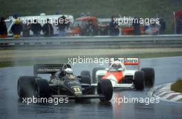 Elio de Angelis (ITA) Lotus 97T Renault leads Alain Prost (FRA) McLaren MP4/2B Tag Porsche