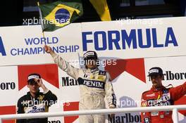 Ayrton Senna da Silva (BRA) 2nd position Nelson Piquet (BRA) Williams 1st position Nigel Mansell (GBR) Williams 3rd position celebrates podium
