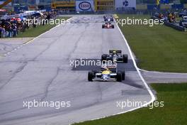 Nelson Piquet (BRA) Williams FW11 Honda 1st position leads Ayrton Senna da Silva (BRA) Lotus 98T Renault 2nd position