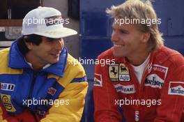 Nelson Piquet (BRA) Williams talks with Stefan Johansson (SWE) Ferrari