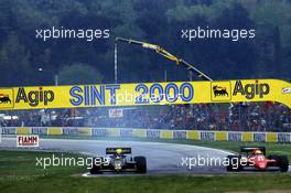Ayrton Senna da Silva (BRA) Lotus 98T Renault and Michele Alboreto (ITA) Ferrari F186