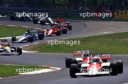 Alain Prost (FRA) McLaren MP4/2C Tag Porsche 1st position leads the group at Variante Acque Minerali