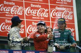 Nelson Piquet (BRA) Williams 2nd position Alain Prost (FRA) McLaren 1st position Gerhard Berger (AUT) Benetton 3rd position celebrates on podium