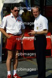 John Barnard (GBR) McLaren talks with Marco Piccinini (ITA) Ferrari