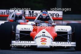 Keke Rosberg (FIN) McLaren MP4/2C Tag Porsche leads teammate Alain Prost (FRA)