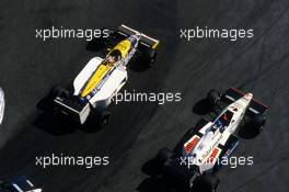 Nelson Piquet (BRA) Williams FW11 Honda passes Philippe Streiff (FRA) Tyrrell 015 Renault at chicane du port