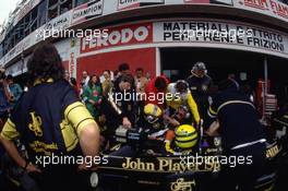 Ayrton Senna da Silva (BRA) Lotus 98T Renault talks with Gerard Ducarouge and Peter Warr