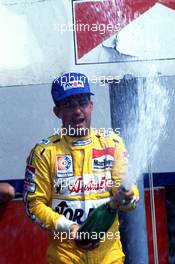 Ivan Capelli (ITA) March 86B Ford Cosworth Genoa Racing 1st position celebrate on podium