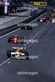 Nigel Mansell (GBR) Williams FW11 Honda 1st position leads Stefan Johansson (SWE) Ferrari F186 3rd position