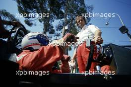 Alain Prost (FRA) McLaren talks with Ron Dennis