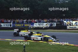 Nelson Piquet (BRA) Williams FW11 Honda 2nd position battles with teammate Nigel Mansell (GBR) 1st position