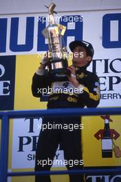 Ayrton Senna da Silva (BRA) Lotus 1st position celebrates podium