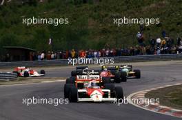 Alain Prost (FRA) Mc Laren MP4/3 Tag Porsche 1st position leads a group