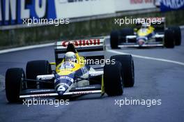 Riccardo Patrese (ITA) Williams FW12 Judd leads teammate Nigel Mansell (GBR)