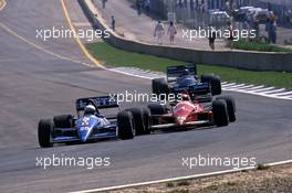 Rene Arnoux (FRA) Ligier JS31 Judd battles with Alex Caffi (ITA) Dallara 188 Ford Cosworth BMS Scuderia Italia