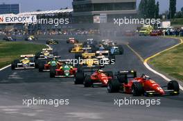 Gerhard Berger (AUT) Ferrari f187/88C leads a group