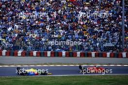 Gerhard Berger (AUT) Ferrari F187/88C leads Thierry Boutsen (BEL) Benetton B188 Ford Cosworth 3rd position