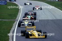 Nelson Piquet (BRA) Lotus 100T Honda 3rd position leads a group