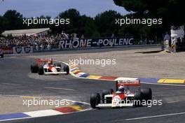 Alain Prost (FRA) McLaren MP4/4 Honda 1st position leads teammate Ayrton Senna da Silva (BRA) 2nd position