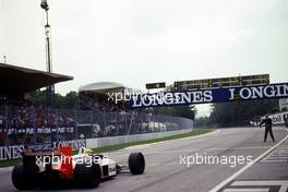 Ayrton Senna da Silva (BRA) McLaren MP4/4 Honda 1st position receives the checkered flag