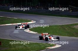 Ayrton Senna da Silva (BRA) McLaren MP4/4 Honda 1st position leads teammate Alain Prost (FRA) 3rd position
