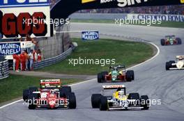 Gerhard Berger (AUT) Ferrari 187/88C battles with Riccardo Patrese (ITA) Williams FW12 Judd at Tosa corner