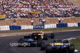 Riccardo Patrese (ITA) Williams FW12 Judd leads a group