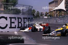 Ayrton Senna da Silva (BRA) McLaren Mp4/5 Honda passes Riccardo Patrese (ITA) Williams FW12C Renault 2nd position