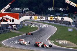 Ayrton Senna da Silva (BRA) McLaren MP4/5 Honda 1st position leads teammate Alain Prost (FRA) 2nd position at Tosa corner
