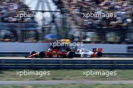 Nigel Mansell (GBR) Ferrari 640 1st position passes Alain Prost (FRA) McLaren MP4/5 Honda 2nd position