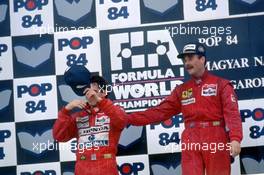 Nigel Mansell (GBR) Ferrari 1st position and Ayrton Senna da Silva (BRA) McLaren 2nd position celebrates podium
