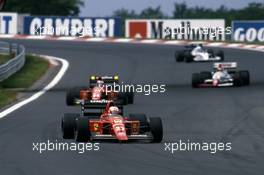 Nigel Mansell (GBR) Ferrari 640 1st position leads teammate Gerhard Berger (AUT)