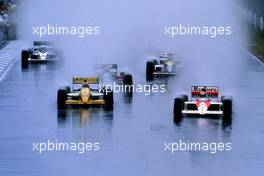Ayrton Senna da Silva (BRA) McLaren MP4/5 Honda leads a group