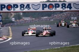 Alex Caffi (ITA) Dallara 189 Ford Cosworth Bms Scuderia Italia battles with Alain Prost (FRA) McLaren MP4/5 Honda