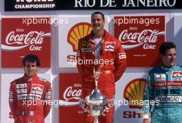 Alain Prost (FRA) McLaren 2nd position Nigel Mansell (GBR) Ferrari 1st position Mauricio Gugelmin (BRA) March Leyton House 3rd position celebrates podium