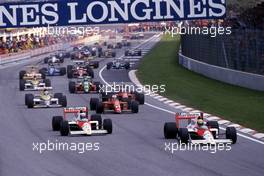 Ayrton Senna da Silva (BRA) McLaren MP4/5 Honda 1st position leads teammate Alain Prost (FRA) 2nd position at start