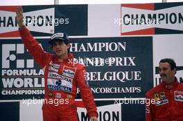 Ayrton Senna da Silva (BRA) McLaren 1st position and Nigel Mansell (GBR) Ferrari 3rd position celebrates podium