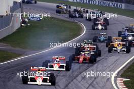 Ayrton Senna da Silva (BRA) McLaren MP4/5 Honda 1st position leads teammate Alain Prost (FRA) 2nd position at start