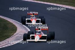 Alain Prost (FRA) McLaren Mp4/5 Honda leads team mate Ayrton Senna da Silva (BRA)
