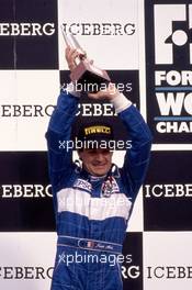 Jean Alesi (FRA) Tyrrell 2nd position celebrates podium