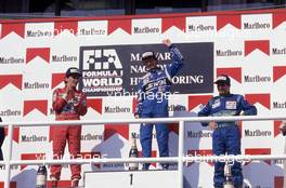 Ayrton Senna da Silva (BRA) McLaren 2nd position Thierry Boutsen (BEL) Williams 1st position Nelson Piquet (BRA) Benetton 3rd position celebrate podium