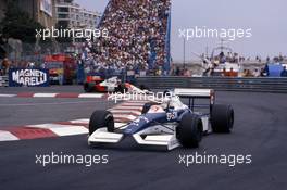 Jean Alesi (FRA) Tyrrell 019 Ford Cosworth 2nd position leads Gerhard Berger (AUT) McLaren MP4/5B Honda 3rd position