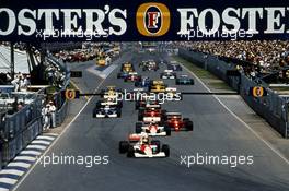 Ayrton Senna da Silva (BRA) McLaren MP4/5B Honda leads the group at start